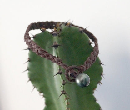 Bracelet tressé quatre brins plats et sa perle de Tahiti - Jerry