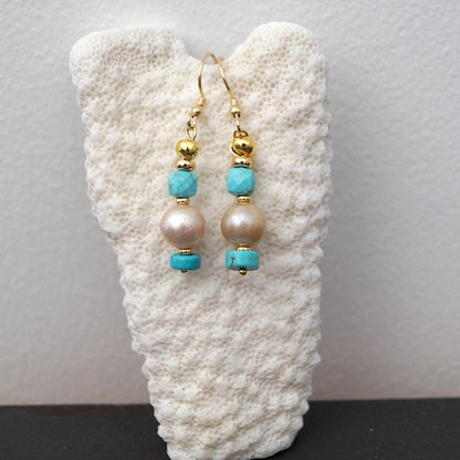 boucle oreille dorée et perle